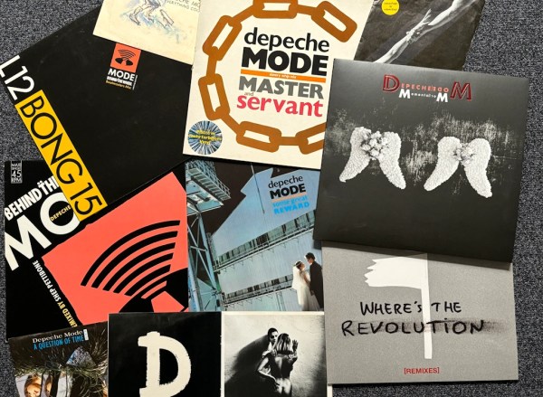 Collection of Depeche Mode vinyl records and singles featuring iconic album covers such as Master and Servant, Behind the Wheel, A Question of Time, and Where’s the Revolution.